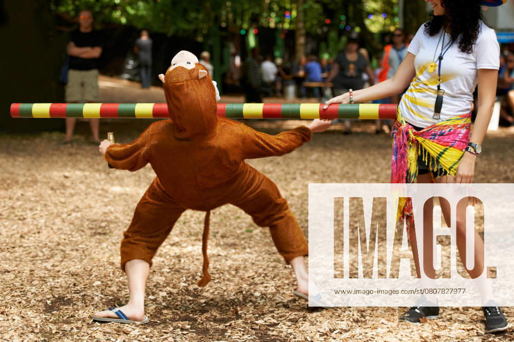 Summer, vacation and man in game of limbo, balance and playing at a music festival, event and challenge. Fun, people and outdoor in woods, forest or person in social activity at party in monkey suit., model released, , 56569388.jpg, summer, vacation, man, game, people, party, fun, person, outdoor, playing, forest, suit, social, festival, play, event, balance, activity, woods, monkey, challenge, music festival, limbo, woman, male, standing, outside, back, nature, outdoors, day, green, guy, tree, funny, carefree, relaxed, cool, trees, entertainment, celebration, leaning, recreation, crazy, games, low, leisure, bending, playful, costume RECORD DATE NOT STATED