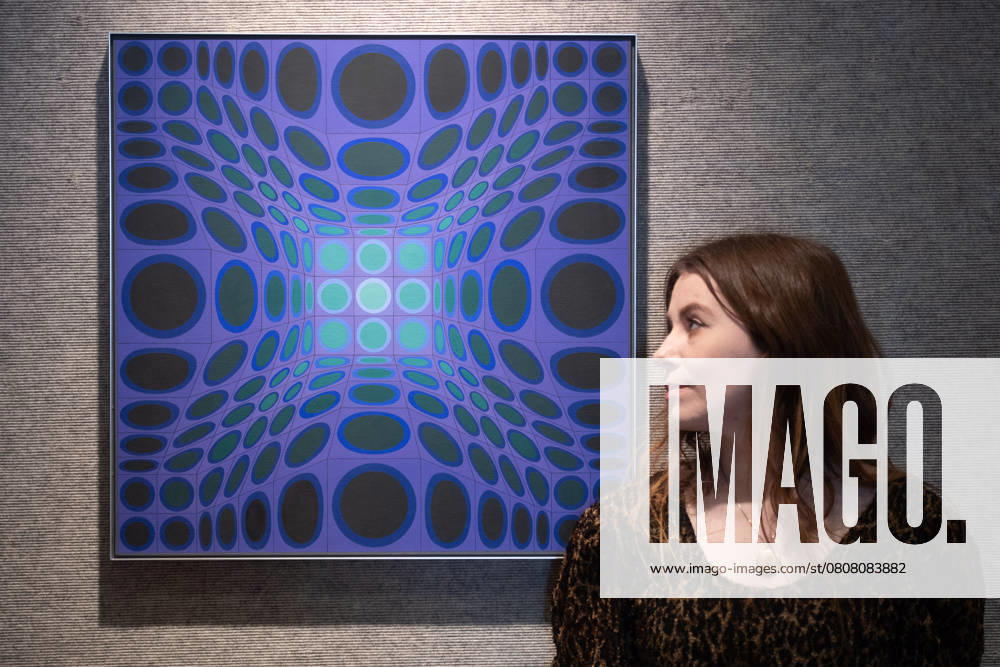 Bonhams 20th 21st Century Art Day Evening Sales Highlights Photocall - Bonhams, London A staff member views Diade by Victor Vasarely (est £30k -£50k) which is to go on auction at Bonhams 20th 21st Century Art Day Evening Sales at Bonhams in London, England, UK on Monday 31 March, 2025., Credit:Justin Ng Avalon UK, England, London, Bonhams