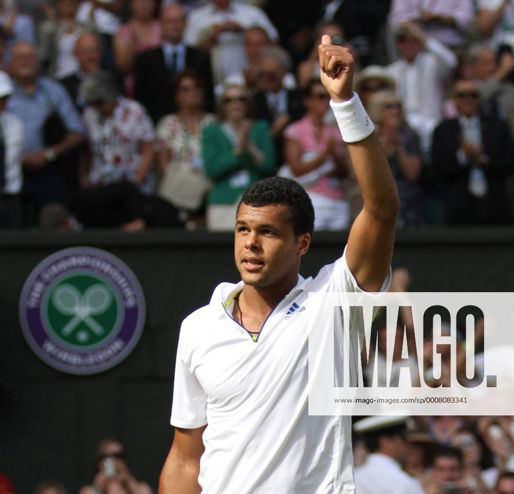 France s Jo-Wilfried Tsonga celebrates his victory on the ninth day of the 125th Wimbledon Championships in Wimbledon, on Wednesday, June 29, 2011. LON2011062901
