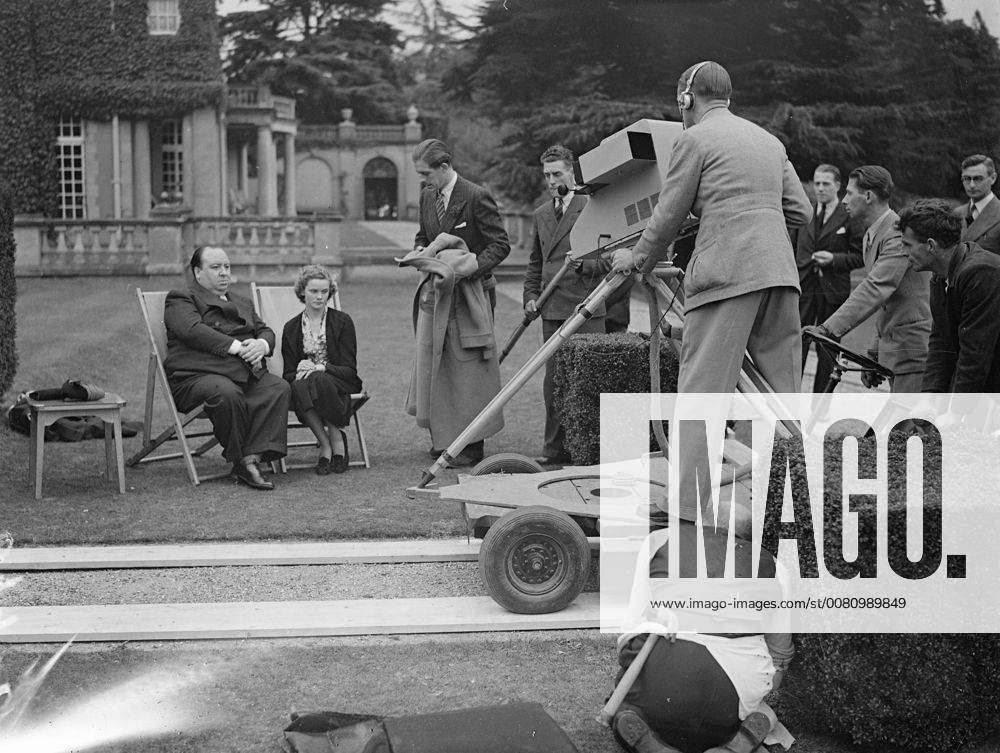 Nova Pilbeam and Alfred Hitchcock being televised and the last programme at Pinewood Studios, Buckinghamshire. BBC engineers had to pit in high-speed work to make the relay possible for television aerial had been blown down in a storm and temporary mast had to be put up. 5 October 1937., United Kingdom England