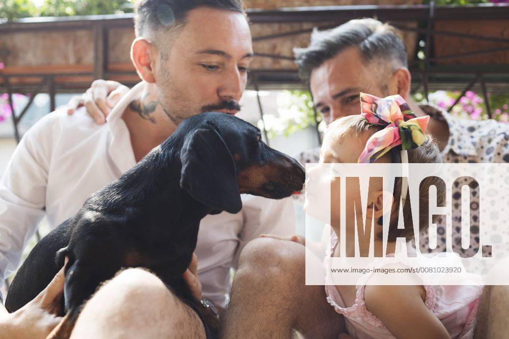 Gay couple with daughter and dog on balcony model released Symbolfoto property released MRAF00224