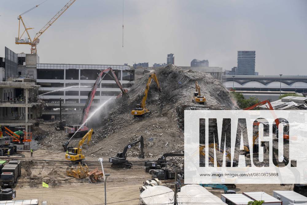 Heavy machinery is used to clear away wreckage from the State Audit Office construction site collapse in Bangkok, Thailand caused by the March 28th 7.7 earthquake in neighboring Myanmar. The under construction government high rise stood at 33 stories tall when the earthquake struck while the workers were on their lunch break, causing it to implode downward with violent force. Official numbers list 27 dead and 19 injured from the site with 67 still unaccounted for. Bangkok Thailand - ZUMAt128 20250411_zap_t128_004