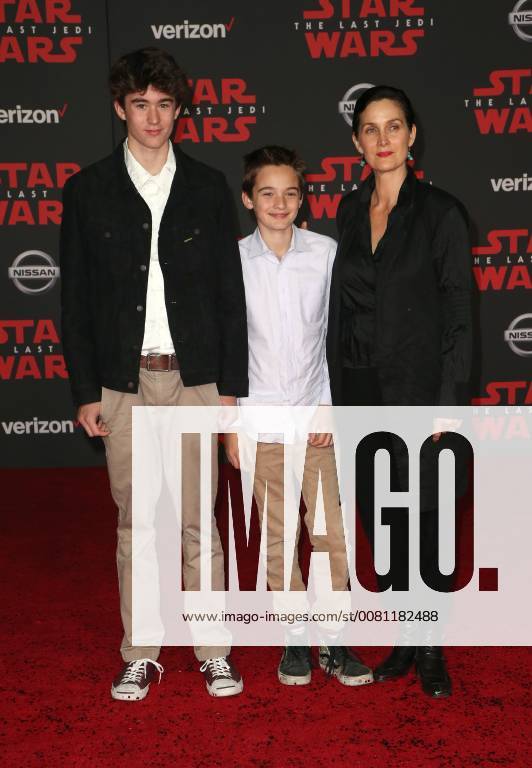 LOS ANGELES, CA - DECEMBER 9: Carrie-Anne Moss, Frances Beatrice Roy, Jaden Roy, Owen Roy, at Premiere Of Disney Pictures And Lucasfilm s Star Wars: The Last Jedi at Shrine Auditorium in Los Angeles, California on December 9, 2017.