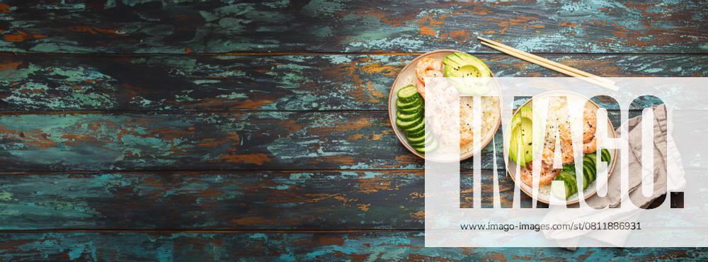 Two white ceramic bowls with rice, shrimps, avocado, vegetables and sesame seeds and chopsticks on colourful rustic wooden background top view. Healthy asian style poke bowl, space for text. , 58639020.jpg, bowl, rice, asia, dinner, poke, food, shrimp, meal, seafood, copy space, space for text, banner, template, menu, lunch, asian, avocado, green, plate, vegetable, healthy, prawn, gourmet, restaurant, tasty, fried, thai, sauce, fresh, homemade, white, above, sesame, chinese, chopsticks, lime, salad, cooking, top view, wooden, diet, appetizer, oriental, cooked, curry, hawaiian, japanese, cucumber, dish RECORD DATE NOT STATED