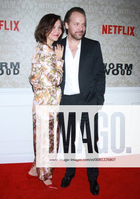 NEW YORK, NY - DECEMBER 12: Maggie Gyllenhaal, Peter Sarsgaard, at the Netflix premiere of Wormwood at The Campbell in New York City on December 12, 2017.