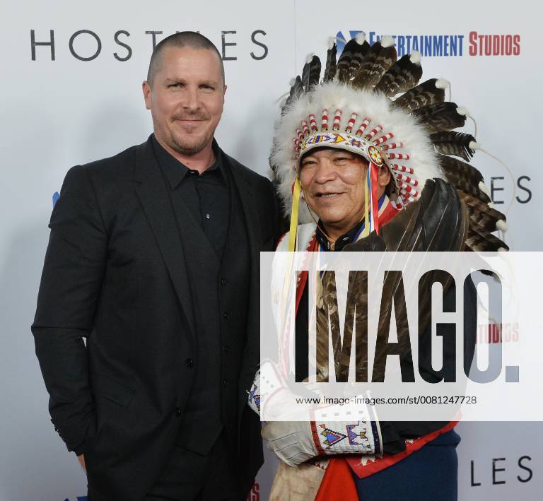 Cast member Christian Bale and Chief Phillip Whiteman Jr.attend the premiere of the motion picture western Hostiles at the Academy of Motion Picture Arts & Sciences in Beverly Hills, California on December 14, 2017. Storyline: In 1892, a legendary Army captain reluctantly agrees to escort a Cheyenne chief and his family through dangerous territory. LAP2017121407 JIMxRUYMEN