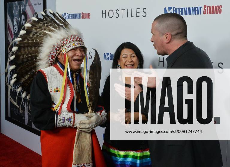 Cast member Christian Bale greets Chief Phillip Whiteman Jr. and his wife Lunette Two Bulls as they arrive for the premiere of the motion picture western Hostiles at the Academy of Motion Picture Arts & Sciences in Beverly Hills, California on December 14, 2017. Storyline: In 1892, a legendary Army captain reluctantly agrees to escort a Cheyenne chief and his family through dangerous territory. LAP2017121426 JIMxRUYMEN