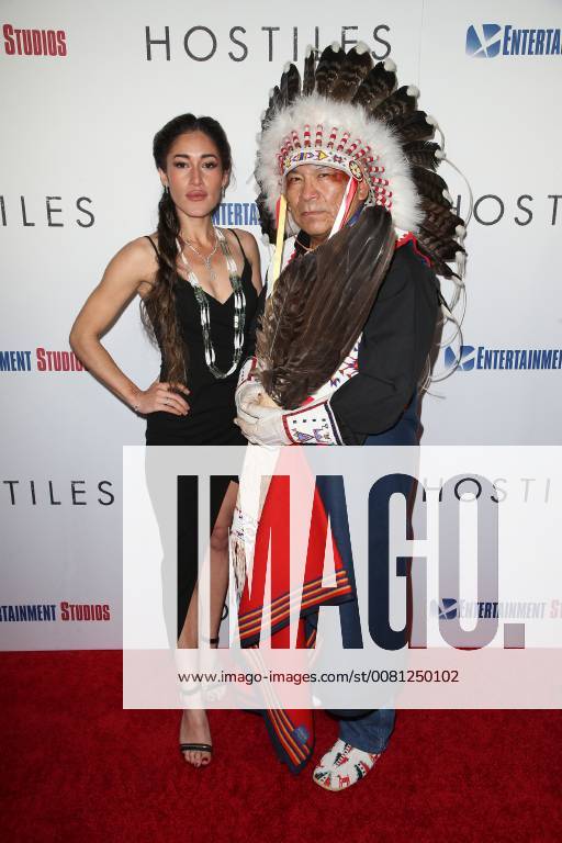 BEVERLY HILLS, CA - DECEMBER 14: Q Orianka Kilvcher, Chief Phillip Whiteman Jr., at Premiere Of Entertainment Studios Motion Pictures Hostiles at Samuel Goldwyn Theater, In Beverly Hills, California on December 14, 2017.