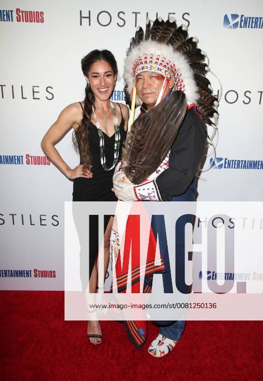 BEVERLY HILLS, CA - DECEMBER 14: Q Orianka Kilvcher, Chief Phillip Whiteman Jr., at Premiere Of Entertainment Studios Motion Pictures Hostiles at Samuel Goldwyn Theater, In Beverly Hills, California on December 14, 2017.
