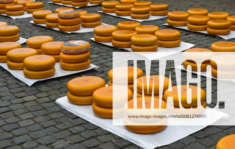 Gouda cheese wheels piled up on the cheese market, Gouda, Netherlands