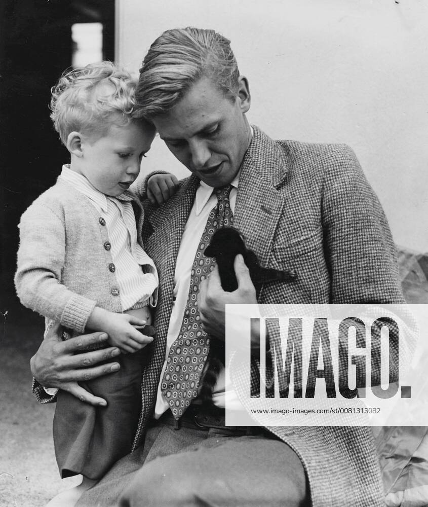 IMAGO ICONS: Sir David Attenborough Robert 3 1 2 is asking his father, David Attenborough, as they view a Coati-mundi, one of the animals brought him from the combined London zoo, expedition to British Guiana. Robert was at London airport today to meet his father on his return from South America via Amsterdam. 23 June 1955, London United Kingdom England
