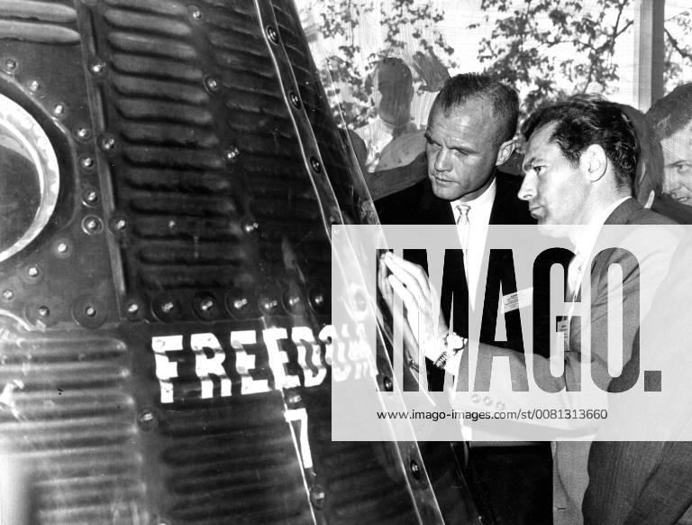 Major Gherman Stepanovich Titov (left), the second Soviet astronaut launched into space aboard Vostok II, seen here with US astronaut John Glenn. Glenn shows Titov the Freedom 7 Capsule in which Alan Shepard made the U.S. first man orbit space flight. 7 May 1962, Washington D.C. United States