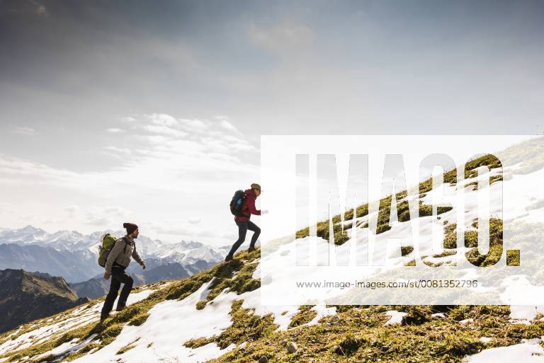 Germany, Bavaria, Oberstdorf, two hikers walking up alpine meadow model released Symbolfoto UUF12164