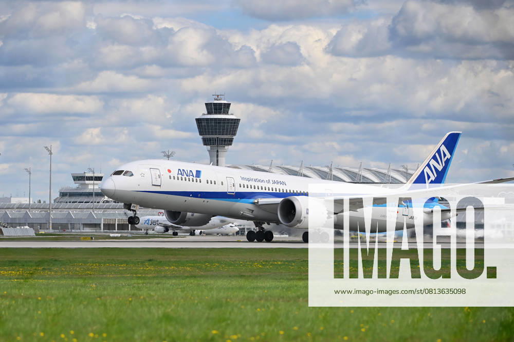 ANA All Nippon Airways JA89IA B787 Dreamliner takes off, takeoff in front of tower and terminal passenger jets at Franz Josef Strauss Airport in Munich Munich