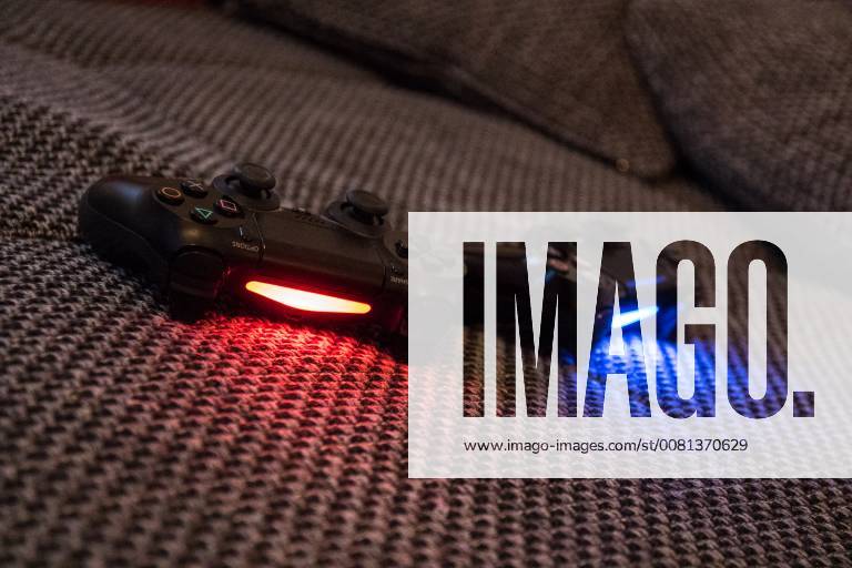 4 controller on couch playing PlayStation video games console