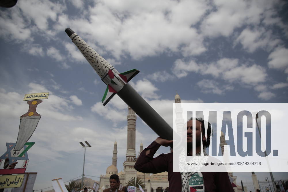 Houthi supporters protest against the US in Sanaa - A Houthi supporter holds up a mock rocket during a protest against the United States, in Sana a, Yemen, 25 April 2025. IMAGO Sanaa Yemen