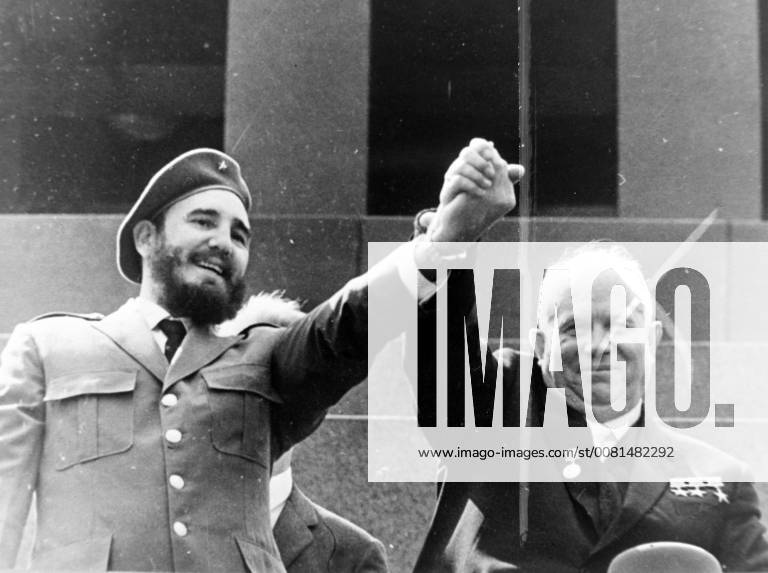 SOVIET PRIME MINISTER NIKITA KHRUSHCHEV WITH CUBAN PRIME MINISTER FIDEL CASTRO HOLDING HANDS AT MAY DAY CELEBRATIONS IN MOSCOW ; 1 MAY 1963,