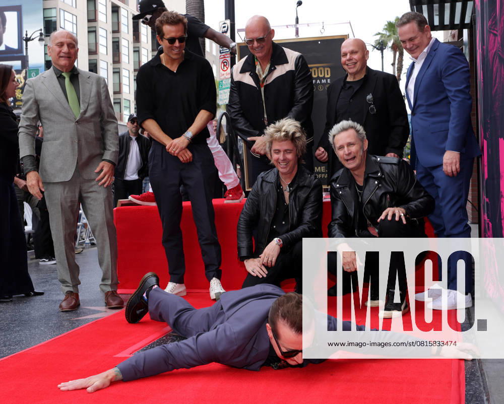 Tré Cool, Billie Joe Armstrong and Mike Dirnt of Green Day pose with their star during an unveiling ceremony honoring them with the 2,810th star on the Hollywood Walk of Fame in Los Angeles on Thursday, May 01, 2025. LAP20250501546 GREGxGRUDT