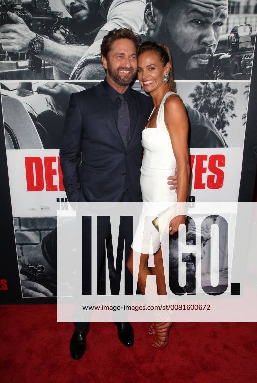 LOS ANGELES, CA - JANUARY 17: Gerard Butler, Morgan Brown, at the premiere of Den Of Thieves at Regal Theaters at LA Live in Los Angeles, California on January 17, 2018.