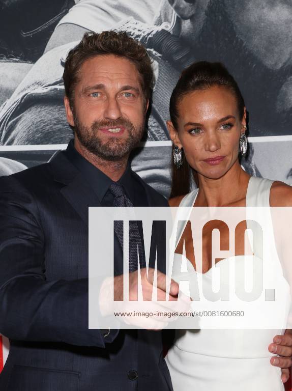 LOS ANGELES, CA - JANUARY 17: Gerard Butler, Morgan Brown, at the premiere of Den Of Thieves at Regal Theaters at LA Live in Los Angeles, California on January 17, 2018.