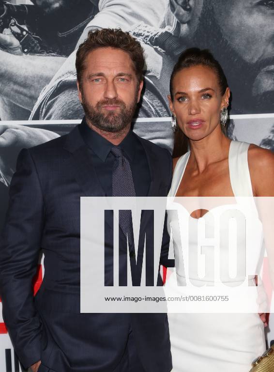 LOS ANGELES, CA - JANUARY 17: Gerard Butler, Morgan Brown, at the premiere of Den Of Thieves at Regal Theaters at LA Live in Los Angeles, California on January 17, 2018.