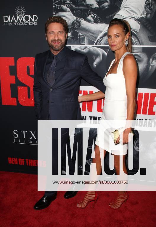 LOS ANGELES, CA - JANUARY 17: Gerard Butler, Morgan Brown, at the premiere of Den Of Thieves at Regal Theaters at LA Live in Los Angeles, California on January 17, 2018.