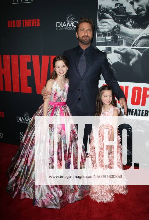 LOS ANGELES, CA - JANUARY 17: Gerard Butler, Elle Whitfield, Madelyn Lazar, at the premiere of Den Of Thieves at Regal Theaters at LA Live in Los Angeles, California on January 17, 2018.