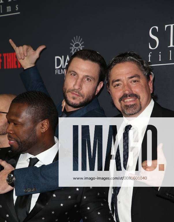 LOS ANGELES, CA - JANUARY 17: Oshea Jackson Jr, Gerard Butler, Pablo Schreiber, Curtis Jackson, at the premiere of Den Of Thieves at Regal Theaters at LA Live in Los Angeles, California on January 17, 2018.