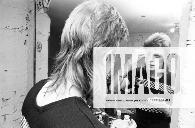 David Bowie 22 May 1973 Backstage at Lewisham, London, making up for a Ziggy Stardust concert with members of the band visible, reflected in the mirror. Premium collection: MINIMUM FEES APPLY please check with requests@topfoto.co.uk, London United Kingdom England