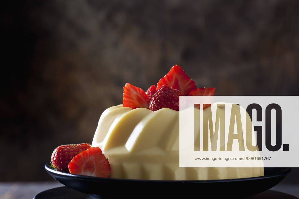 Custard with strawberries on plate CSF28554