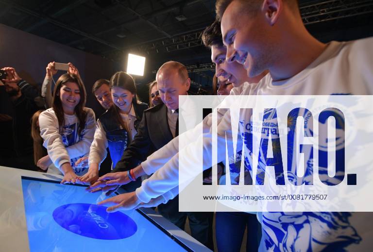 VOLGOGRAD, RUSSIA â€“ FEBRUARY 2, 2018: Russia s President Vladimir Putin (C) meets with members of the Volunteers of Victory movement at the Russia My History museum. Alexei Druzhinin Russian Presidential Press and Information Office TASS TS072087
