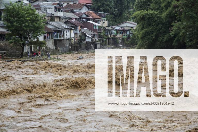 Bogor, West Java, Indonesia - Bogor, West Java, 05 February 2018 : As heavy rain hit most of area in Indonesia, one of the place Bogor that was flowed by Ciliwung River over flowed and hit the area soon also hit Jakarta. Some home and school at the area hit by flood from the river because of stock pile of garbage that halt the flow of the water, it s very common for Indonesia people just throw garbage to the river as the law enforcement for environtment very weak at the country. Bogor Indonesia - ZUMAh128 20180205_zap_h128_020