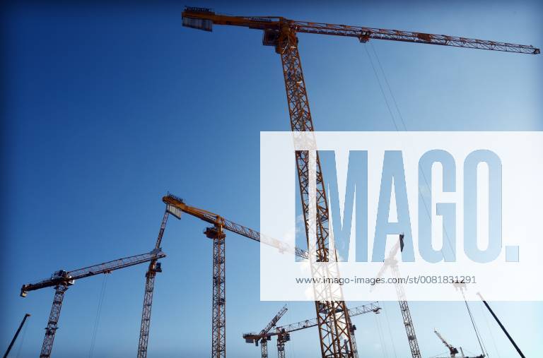 Residential real estate rental apartments condos new construction rental brake vacant social housing construction cranes are on the large plot in the Heath Street in Berlin taken Berlin Germany on 6 February 2018