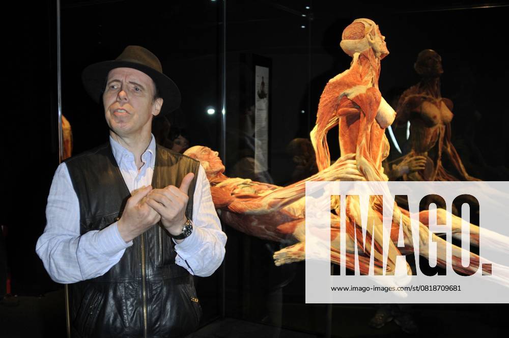 Body Worlds & the Mirror of Time exhibition DR. GUNTHER VON HAGENS & THE SUSPENDED ACT.Press conference for the new sex plastinates which is part of the Body Worlds & the Mirror of Time exhibition at the O2 Arena, Greenwich, south-east London, England..June 23rd, 2009.bodyworks body works full length half muscles internal organs flesh muscle skin models bone sexual position nipple half length black hat blue shirt waistcoat hands .CAP PL.Phil Loftus . London Great Britain