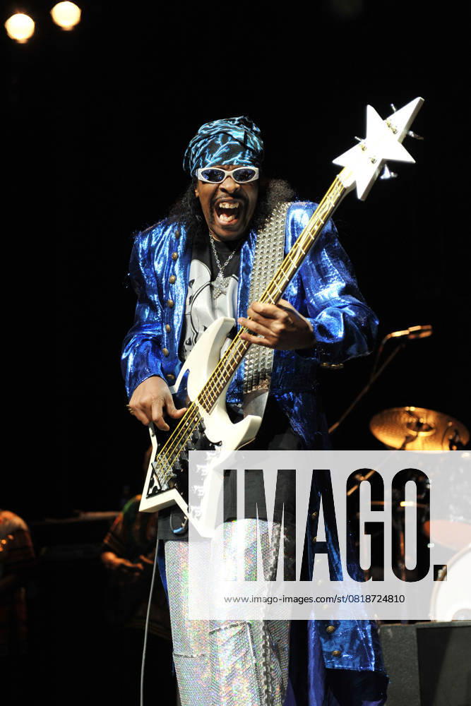 Bootsy Collins live at the indigo2 Bootsy Collins - (William Earl Bootsy Collins) Performing live at the indigo2, London, England. July 11th, 2011 stage concert live gig performance music half 3 4 length silver sparkly shiny trousers blue jacket mouth open bandana black sunglasses shades bass guitar CAP MAR Martin Harris London Great Britain