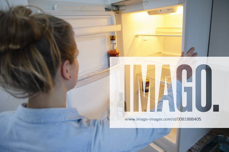 Set recording a woman looks in an empty refrigerator Berlin 13 02 2018 Berlin Germany