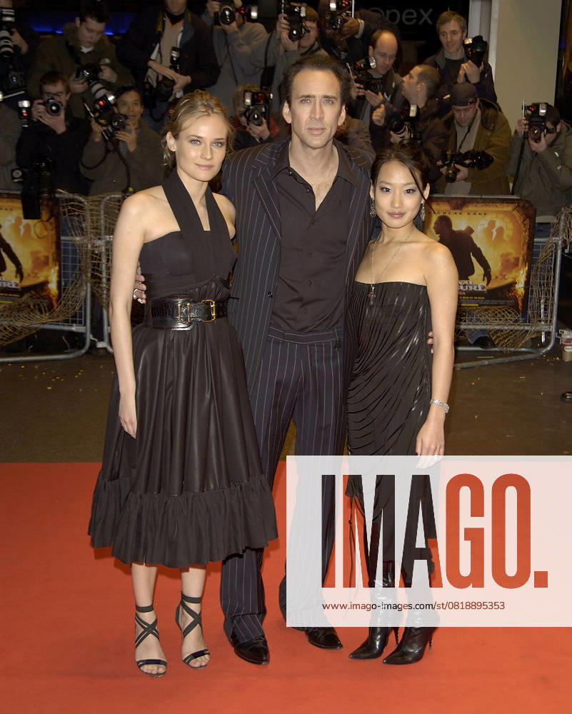 National Treasure premiere DIANE KRUGER, NICOLAS CAGE & ALICE KIM National Treasure premiere Odeon West End Cinema London 5 December 2004. full length black dress belt belted strappy shoes nicholas Ref: PL London Great Britain
