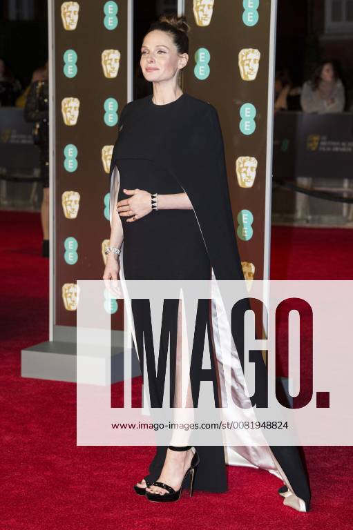 London, London, UK - Pregnant Rebecca Ferguson arrives on the red carpet for the EE British Academy Film Awards 2018, held at the Royal Albert Hall. London UK - ZUMAt138 20180218_zap_t138_069