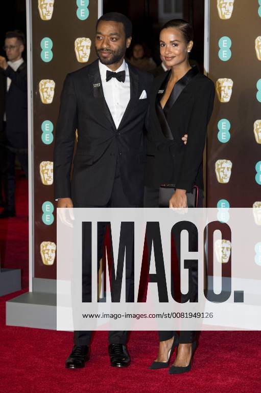 London, London, UK - Chiwetel Ejiofor and Frances Aaternir arrives on the red carpet for the EE British Academy Film Awards 2018, held at the Royal Albert Hall. London UK - ZUMAt138 20180218_zap_t138_119