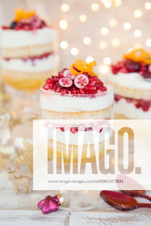 Dessert in layers with white chocolate mousse Orange and pomegranate Christmas trifle 1079704694