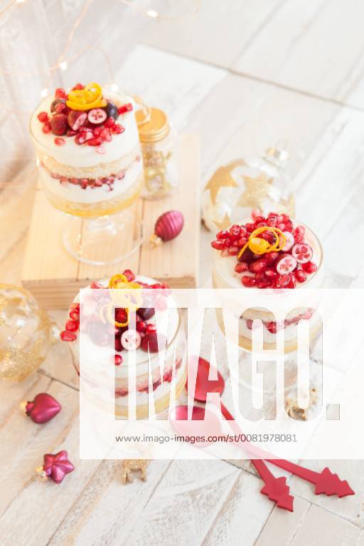 Dessert in layers with white chocolate mousse Orange and pomegranate Christmas trifle 1079704696