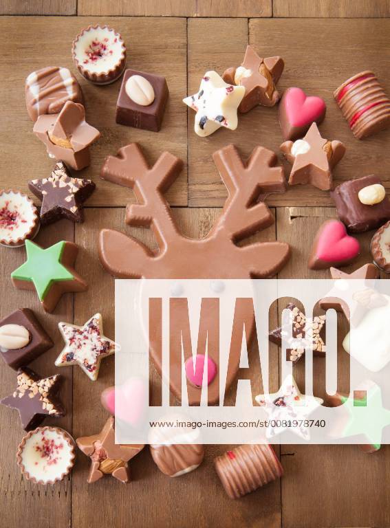 Various chocolate for Christmas on a background of wood Christmas chocolates 1079704698