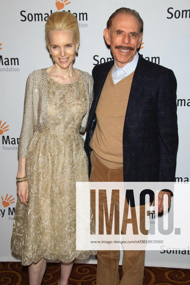 Life Is Love , the Somaly Mam Foundation Gala 2013 Mary & Peter Max Life Is Love , the Somaly Mam Foundation Gala 2013 at Gotham Hall, New York, NY., USA. October 23rd, 2013 half 3 4 length black dress suit jacket beige gold lace dress top trousers moustache mustache facial hair married husband wife CAP LNC TOM LNC New York NY United States