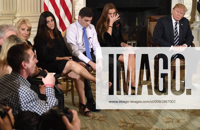 Surviving Parkland, Florida Marjory Stoneman Douglas High School student Samuel Zeif (L) makes remarks as (L-R) Education Secretary Betsy DeVos, Melissa Blank, son Jonathan Blank, Student Body President Julia Cordover (wiping tears) and President Donald Trump listen as they attend a listening session on school violence, at the White House, February 21, 2018, in Washington, DC. The event comes in the aftermath of the shootings where 17 students and teachers were killed by a former student. WAP20180221521 MIKExTHEILER
