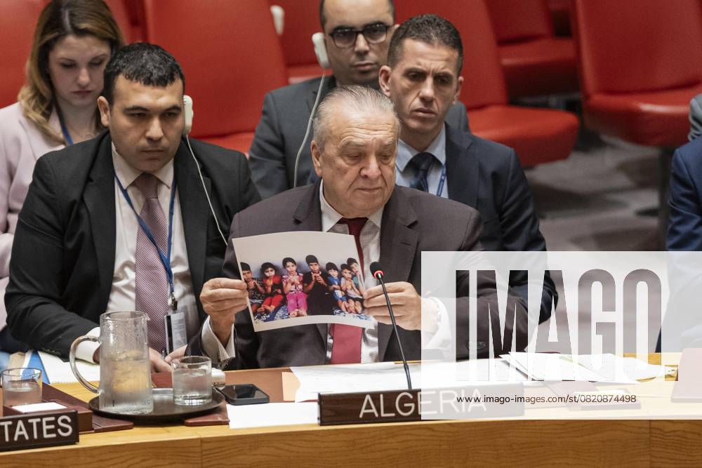 Ambassador Amar Bendjama of Algeria holds photo of doctor s children killed by bombing Gaza by Israel while speaking during Security Council meeting at UN Headquarters in New York on May 28, 2025 New York USA - ZUMAr339 20250528_znp_r339_028