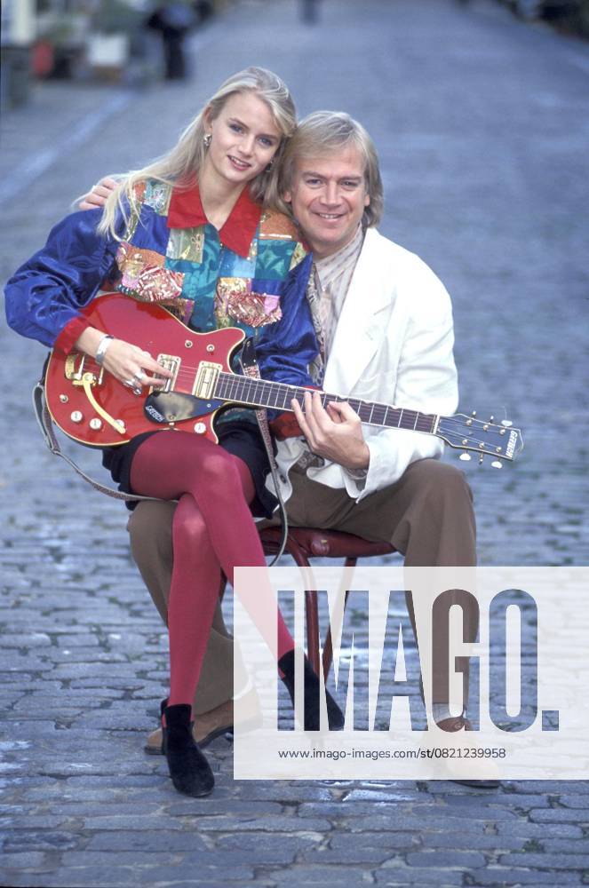 JUSTIN HAYWARD & daughter DOREMI full length full-length sitting on lap knee playing guitar family haywood ref:026 London Great Britain