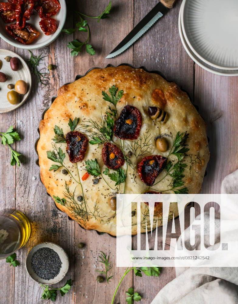 Top view baked focaccia bread decorated with flower design. Kingston, Ontario, Canada CR_DOHO250526D-1742607-01