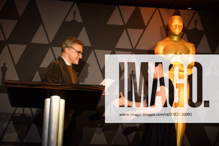 Beverly Hills, California, U.S. - Oscar winner CHRISTOPH WALTZ presents the certificate of nomination to Ildiko Enyedi director of the Oscar nominated foreign film On Body and Soul (Hungary), at the reception for the Foreign Language Film Award category for the 90th Oscars on Friday. Beverly Hills U.S. - ZUMAz03_ 20180302_shf_z03_225