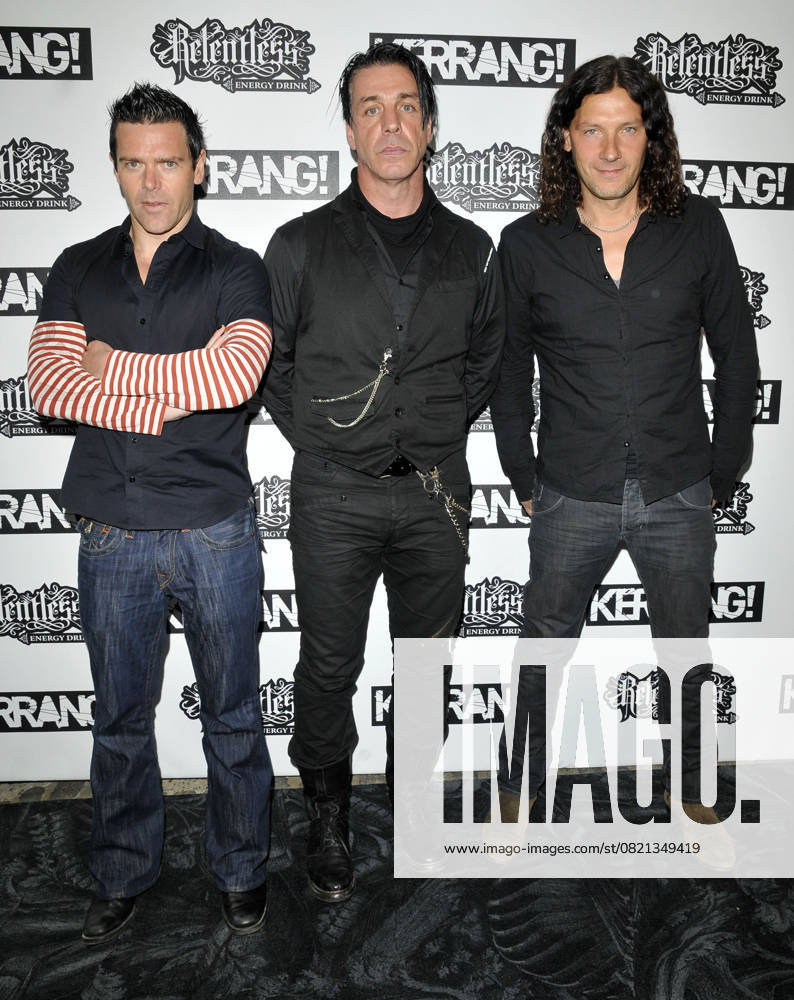 The Relentless Energy Drink Kerrang! Awards RAMMSTEIN The Relentless Energy Drink Kerrang! Awards, The Brewery, London, England, UK. July 29th 2010 band group full length black grey gray stripe white red arms crossed jeans denim Till Lindemann Richard Z. Kruspe Paul H. Landers Oliver Ollie Riedel Christoph Doom Schneider Christian Flake Lorenz CAP CAN Can Nguyen London UK Great Britain