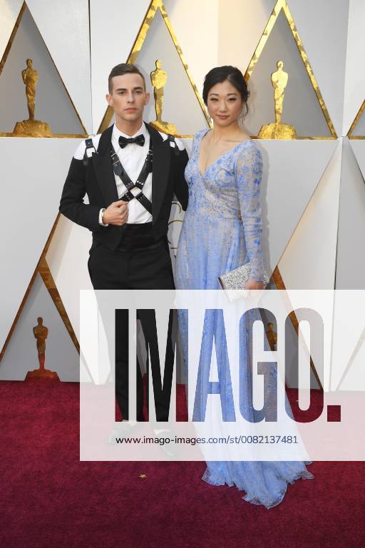 Los Angeles, California, U.S. - ADAM RIPPON and fellow Olympian MIRAI NAGASU arrive on the red carpet for the 90th Annual Academy Awards at the Dolby Theatre. Los Angeles U.S. - ZUMAz03_ 20180304_zbp_z03_004